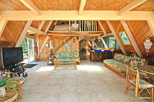 Spacious living room overlooking the beach and gardens